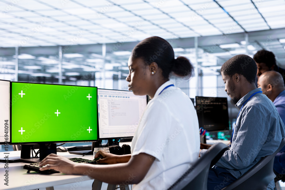 Poster woman in data center updating systems on isolated screen pc to protect servers from exploitable soft