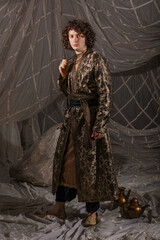 Handsome young man in Arabic-inspired suit with oriental motifs, elegant costume party attire