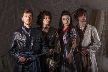 Arabic-style male fashion shoot featuring models in luxurious traditional warrior costumes