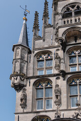 Old Town Hall of Gouda (Stadhuis van Gouda, 1448 - 1450), it is one of oldest Gothic city halls in the Netherlands. Architectural fragments of the facade. Gouda, the Netherlands.