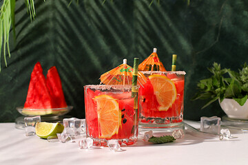 Mojito with lemon, mint, watermelon, ice with tequila, vodka or soda water on elegant background,...