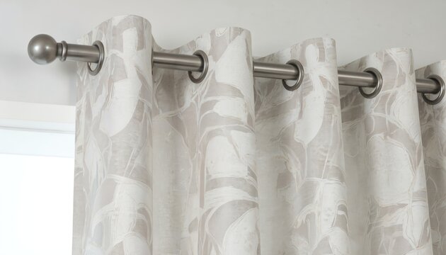 Elegant curtains with modern geometric leaf pattern in soft beige, white tones. Fabric drapes beautifully, offering sense of comfort, style. Perfect for creating cosy ambience in living room bedroom