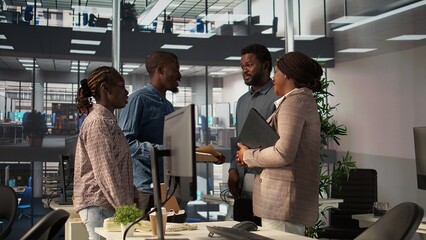 Forecast affiliates reviewing objectives data and performance metrics in a modern office, focusing on corporate strategy and decision making for sustainable enterprise development. Camera B.