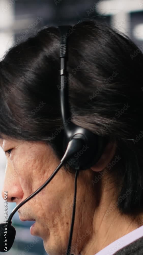 Poster vertical video engineer in data center wearing headset assisting users with ai enhanced troubleshoot