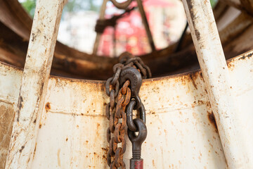 Rustic steel chain with hook is using to fastening and restraining on the heavy object, secure for...