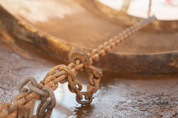 Rustic steel chain with hook is using to fastening and restraining on the heavy object, secure for...