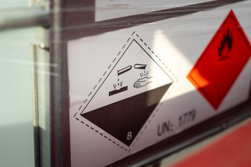 Acidity corrosion or skin burn hazard, safety sign on the chemical containment barrel. Sign and...