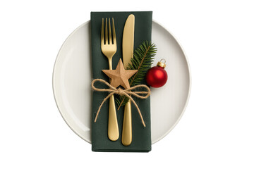 Festive holiday table featuring golden cutlery, pine sprig, wooden star, red bauble, green napkin elegantly arranged on white plate for seasonal dining