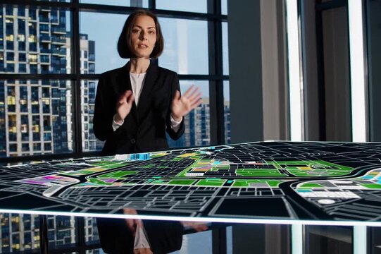 Urban planning presentation showcases interactive model of city development in modern office setting