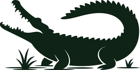 Silhouette of a fierce alligator with mouth open in swampy marshland