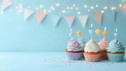 Pastel cupcakes with candles on light blue background (1)