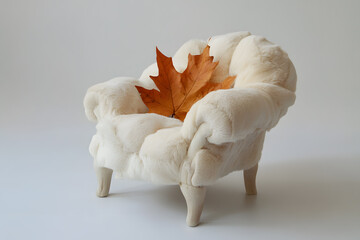 a white chair with a leaf on it