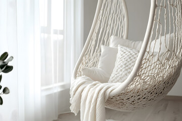 a white chair with a blanket on it