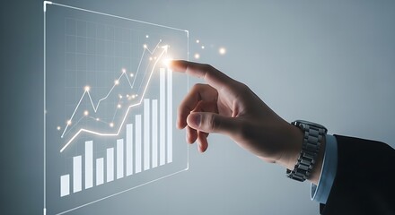 A hand pointing at a rising graph with bars and a line on a screen with a watch on the wrist of the hand