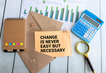words 'Change Is Never Easy But Necessary.
