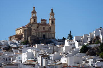 Fototapeta premium Panoramic view of the beautiful white village of Olvera with the church and the castle at sunset. Cadiz, Andalucia, Spain.