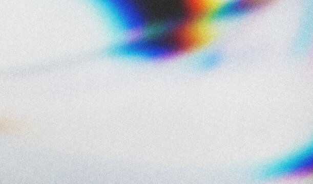 Scattered glitter creates a rainbow effect on a white background, a magical, sparkling scene.