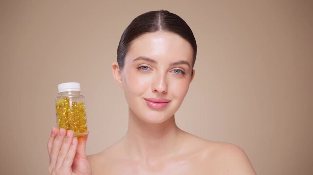 Vitamins. Close Up Of Happy Beautiful Girl With Pill With Cod Liver Oil Omega-3. Nutrition. Vitamin D, E, A Fish Oil Capsules. Healthy Lifestyle. Sport, Diet Concept