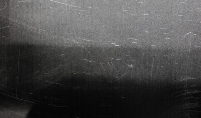Dark scratched grunge background old film effect space for your text or picture dusty texture, with a visible grain noise