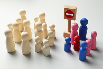 Unemployment. Many different human figures and stop sign on light background, closeup