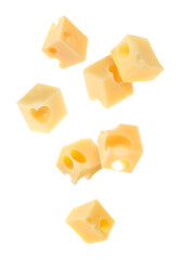 Cheese cubes in air against white background