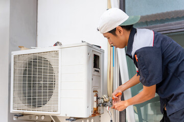 Uninstall an air conditioner, Repairman fix air conditioning systems, Male technician service for...
