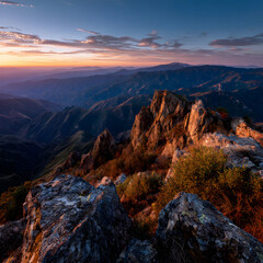 Naklejka premium Golden Hour Over Majestic Mountain Range Illuminated by Vibrant Fall Colors at Sunset