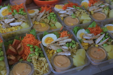 Vegetable salad served in a plastic cup can be packed to take away