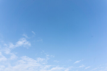Clear Blue Sky with Thin White Clouds on a Sunny Day
