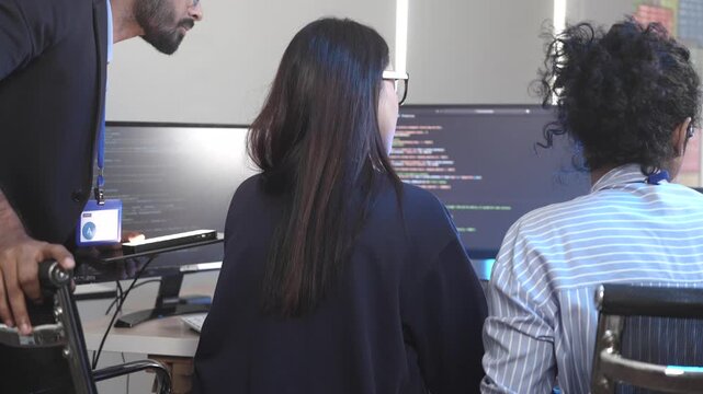 Two female software developers in a pair programming session, debugging complex code on a screen. Concept for agile development, code review, and problem-solving in tech.
