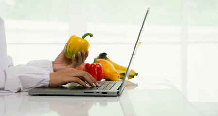 A professional dietitian consults with patients online, discussing nutrition, weight loss, and...