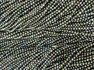 Black pearl background and texture. Beautiful freshwater black pearl 