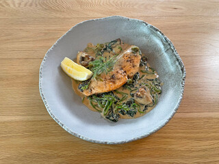 Salmon steak in creamy white wine sauce 