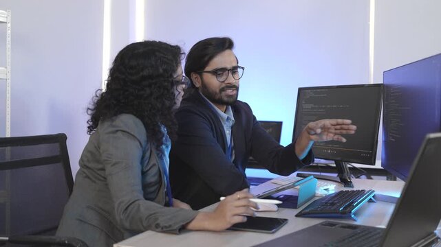 A dedicated IT team collaborates in a command center, working on a critical software deployment or incident response. Concept for system implementation, teamwork, and operations.