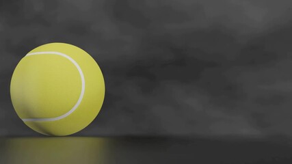 A vibrant yellow tennis ball with white seams is positioned on a reflective dark surface against a dramatic smoky background, symbolizing sports, competition, and activity.