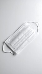 Empty face mask laying flat without human presence