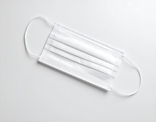 Empty face mask laying flat without human presence