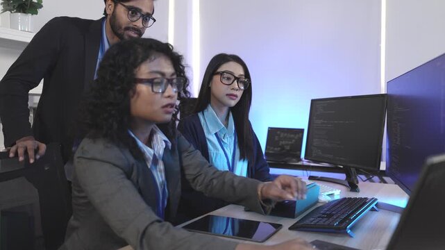 A dedicated IT team collaborates in a command center, working on a critical software deployment or incident response. Concept for system implementation, teamwork, and operations.
