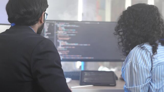 A senior Indian technologist elucidating a complex microservices architecture to a junior developer during a pair programming session on a distributed system. Concept for knowledge transfer in cloud-n