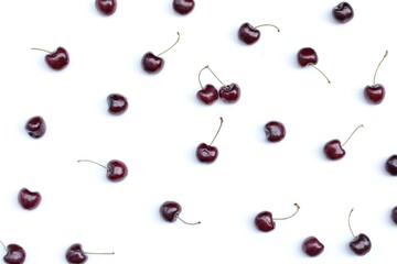 Cherries on a white background, free space, top view