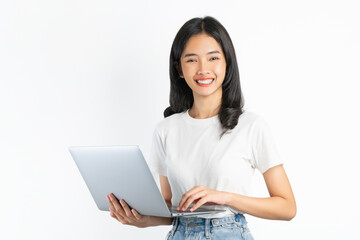 Young Asian woman holding laptop on white background.