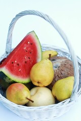 Fruits in a white basket, summer