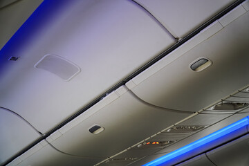 Interior shot showcasing the overhead compartment and lighting design. An aerial perspective emphasizes the seamless integration of functionality and aesthetics, offering a unique view inside.