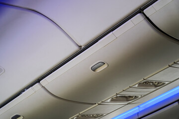 Captured from below, the streamlined interior showcases the overhead compartment with its sleek...
