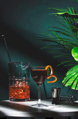 Elegant cocktail preparation with fresh ingredients and vibrant colors in a stylish setting