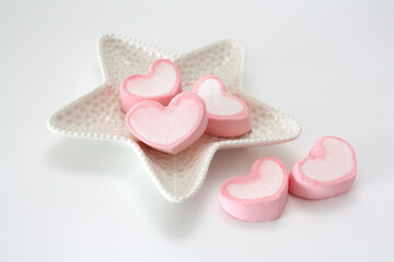 Colorful composition of marshmallows in the shape of a heart.