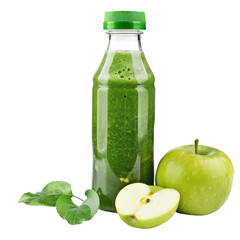 A green apple in front of a green apple in a bottle of green juice.