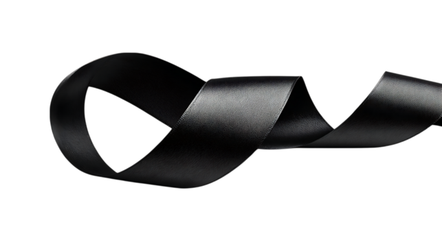 Close up of a black drill bit with textured flutes against a black background