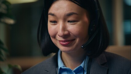 Close up Asian Korean Chinese Japanese woman talking with client consulting in headphones headset...