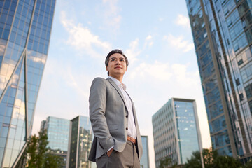 Mature businessman looking at view